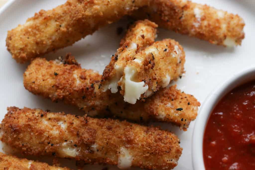 fresh milled fried mozzarella sticks coated in seasoned breadcrumbs