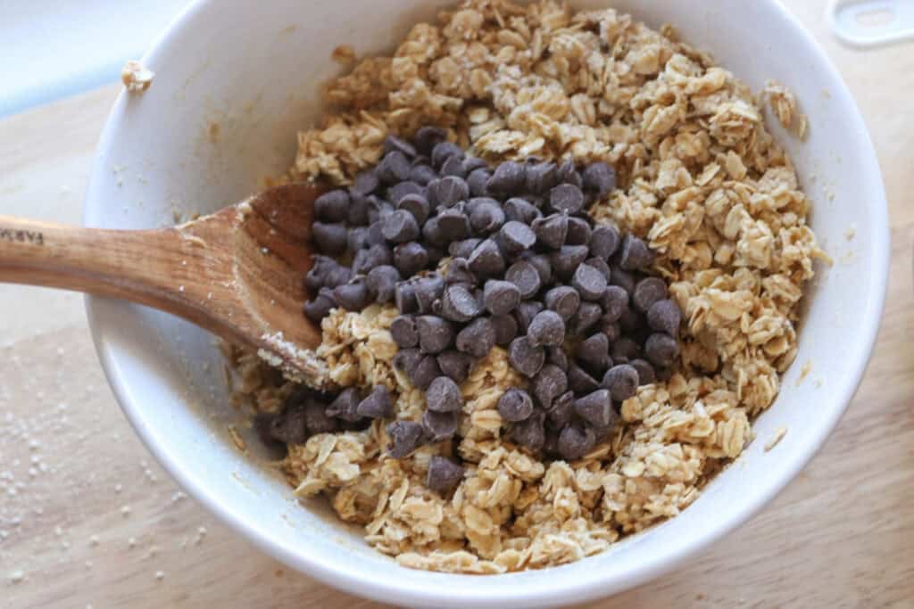 chocolate chips added to the bowl to make Easy and Delicious Copycat Heavenly Hunk Squares