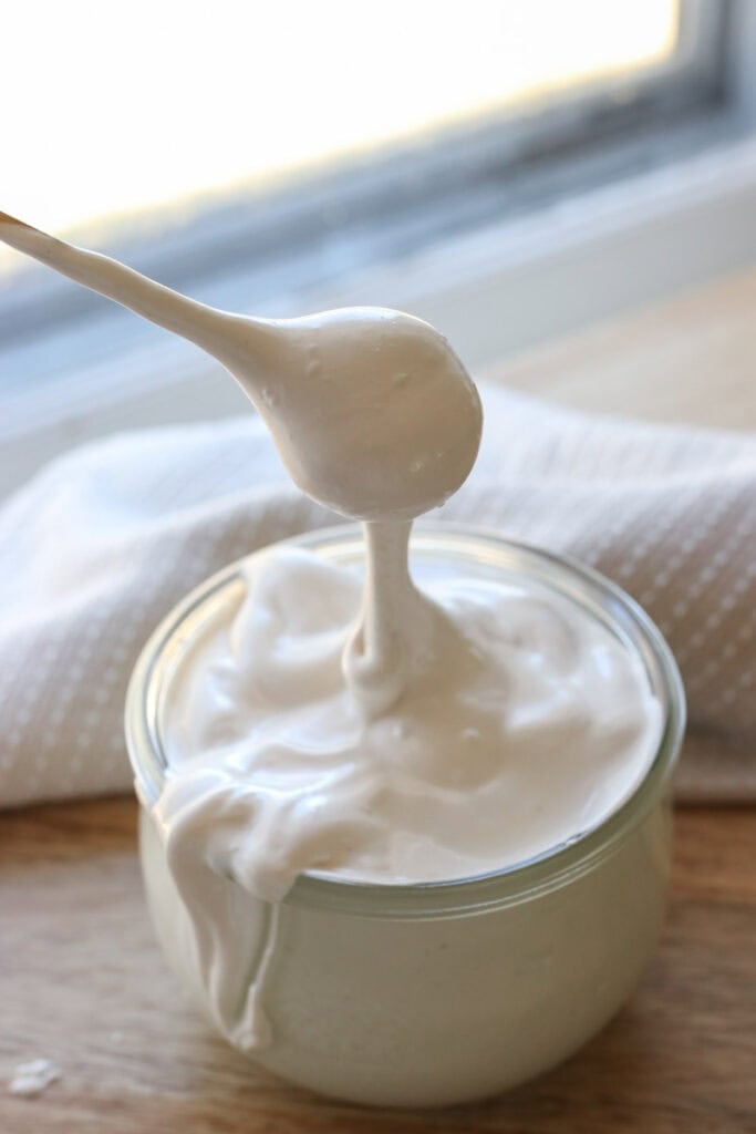 homemade marshmallow fluff dripping off a spoon