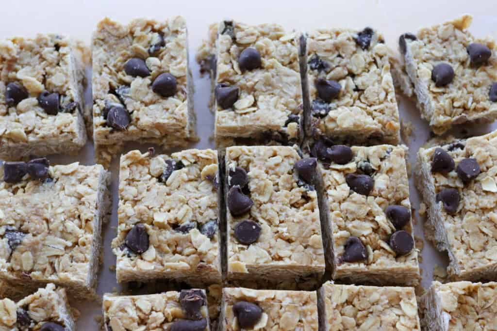 Easy and Delicious Copycat Heavenly Hunks that have been topped with chocolate chips and cut into squares