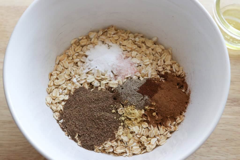 oatmeal and spices in a bowl to make healthy and homemade chai baked oatmeal