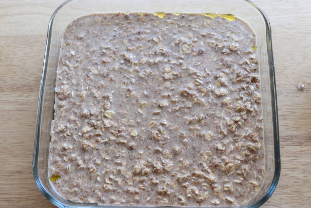 healthy and homemade chai baked oatmeal batter poured into a glass pan