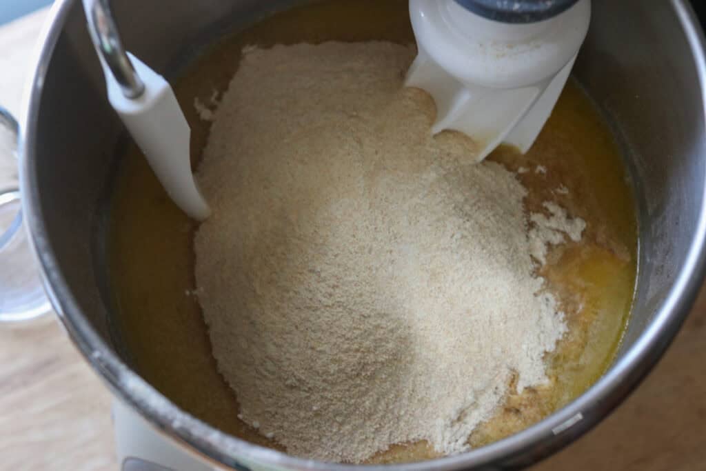 flour added to the mixing bowl to make freshly milled braided challah bread