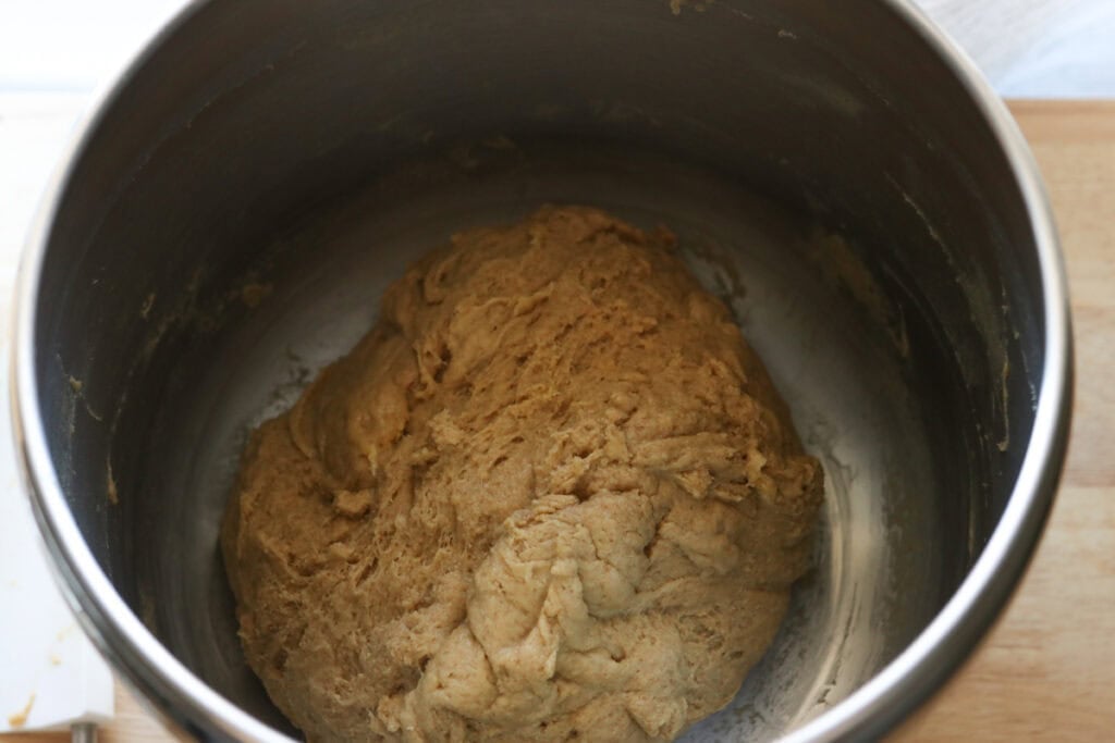 freshly milled challah bread dough in a mixing bowl