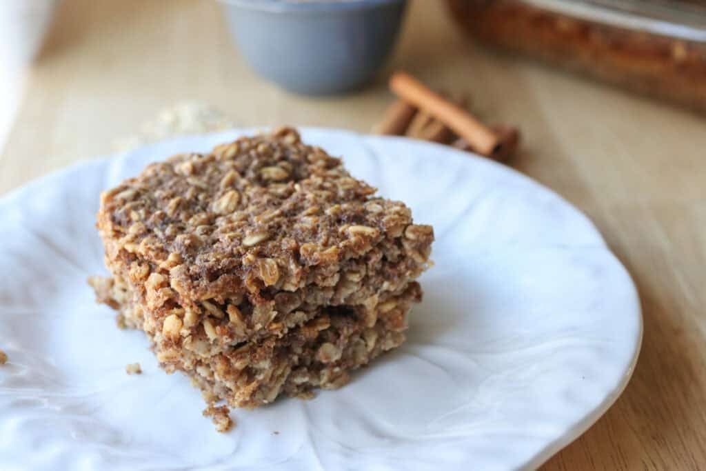 two slices of healthy and homemade chai baked oatmeal on a white plate