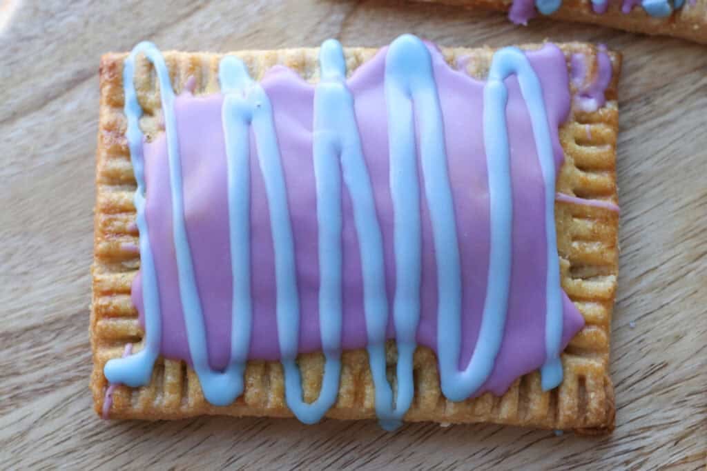 a freshly milled homemade wild berry pop-tart on a wooden board
