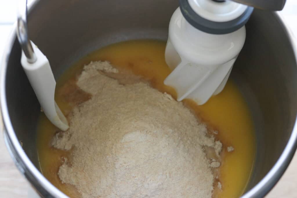 flour added to the mixing bowl to make fresh milled cheesy taco pockets
