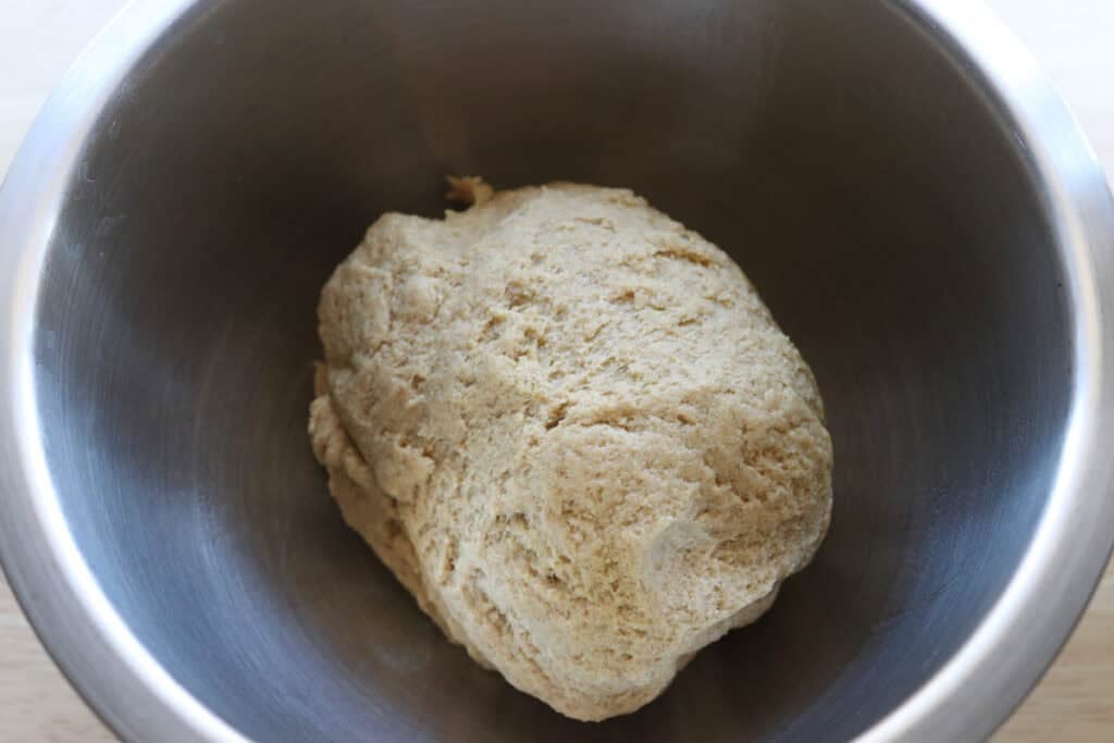 Fresh milled cheesy taco pocket dough in a stainless steel bowl