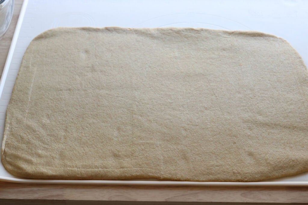 fresh milled dough rolled into a rectangle to make fresh milled cheesy taco pockets