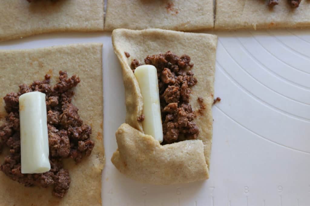 folding dough for Fresh milled cheesy taco pockets