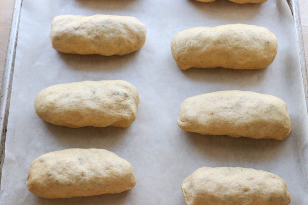 Fresh milled cheesy taco pockets rising on a baking sheet