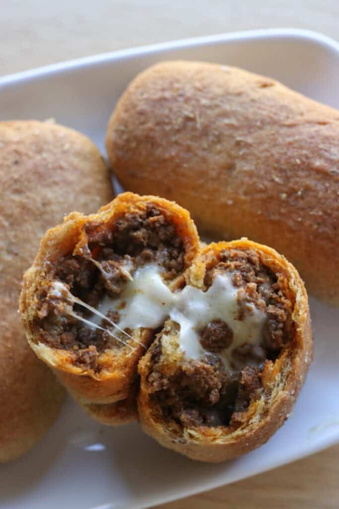 a fresh milled taco pocket filled with seasoned beef and cheese