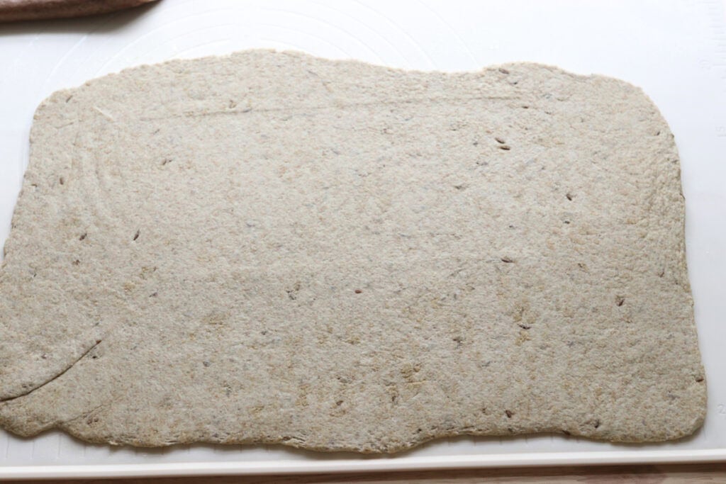 fresh milled light rye dough rolled into a rectangle