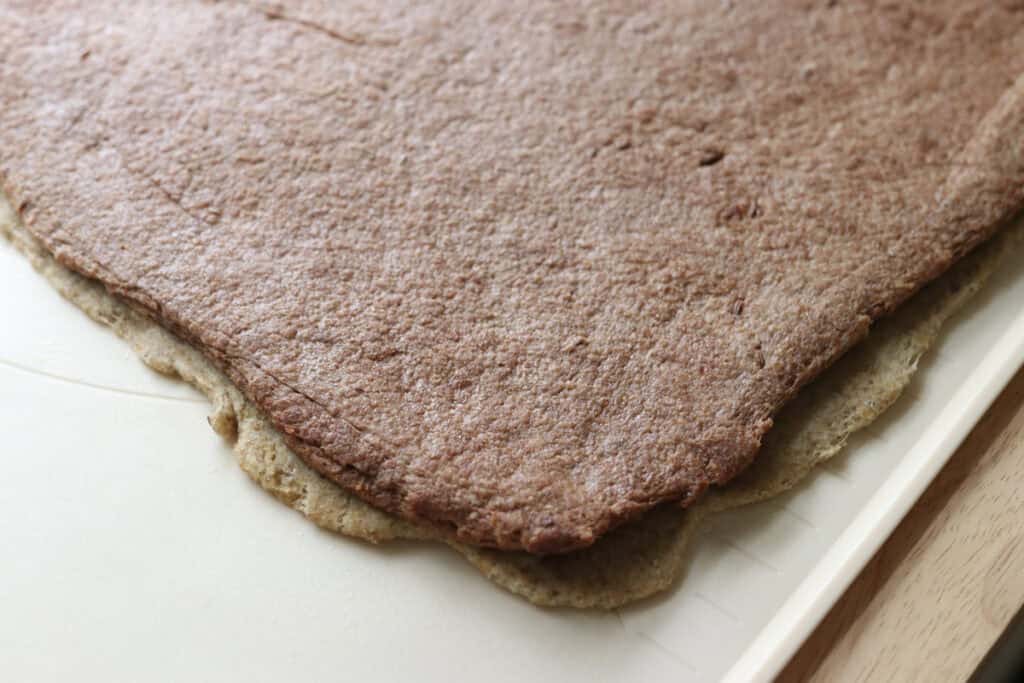 two layers of dough on top of each other to make freshly milled marbled rye bread