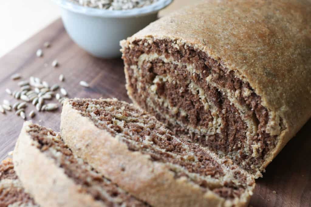 freshly milled marbled rye bread with caraway seeds in it