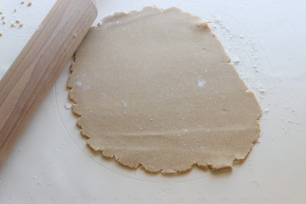 Homemade Fresh Milled Cinnamon Toast Crunch Cereal dough rolled out on a pastry mat