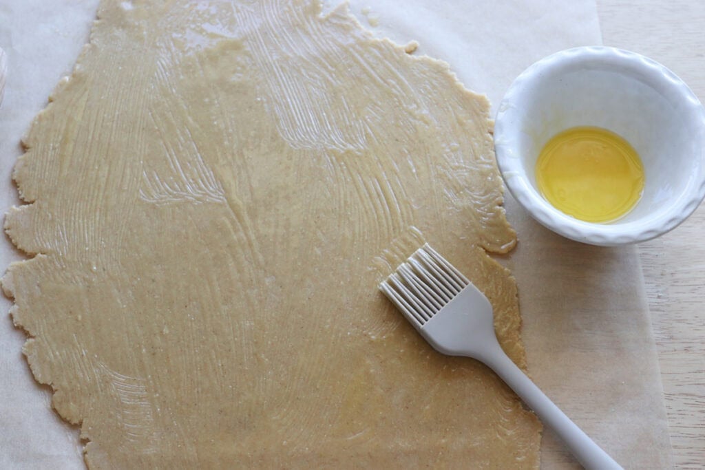 Homemade Fresh Milled Cinnamon Toast Crunch Cereal dough that has been brushed with melted butter