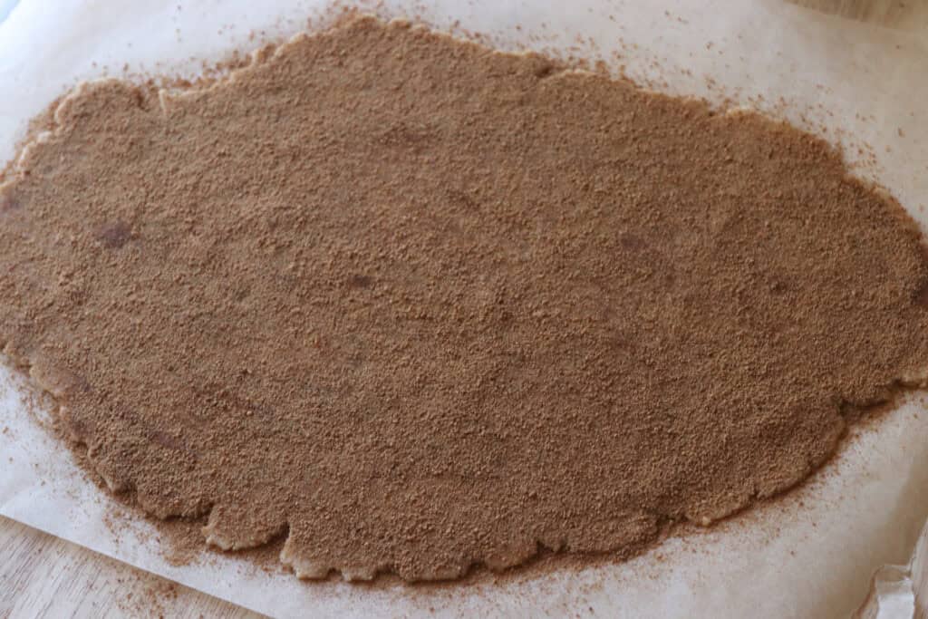 Homemade Fresh Milled Cinnamon Toast Crunch Cereal dough that has been sprinkled with cinnamon and sugar