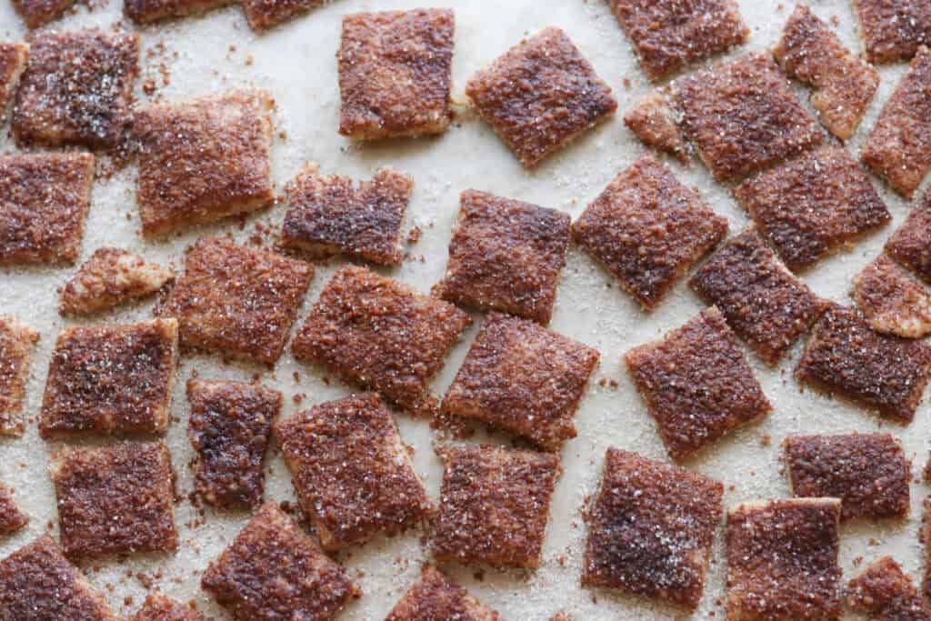 Homemade Fresh Milled Cinnamon Toast Crunch Cereal on a baking sheet that has been baked until crispy
