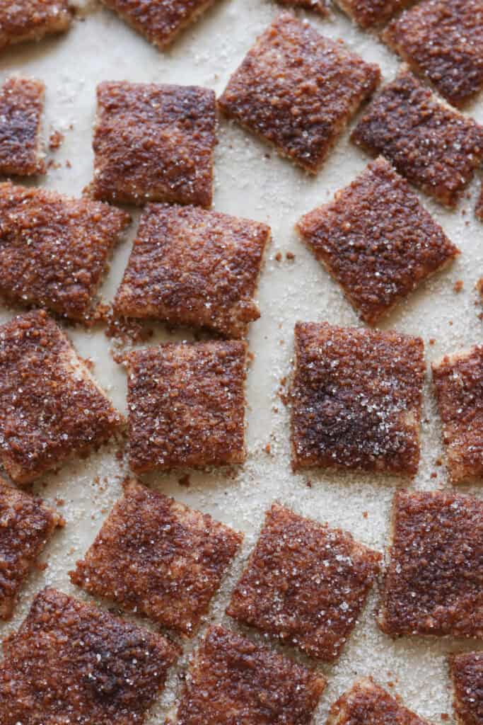 Homemade Fresh Milled Cinnamon Toast Crunch Cereal on a baking sheet with parchment paper