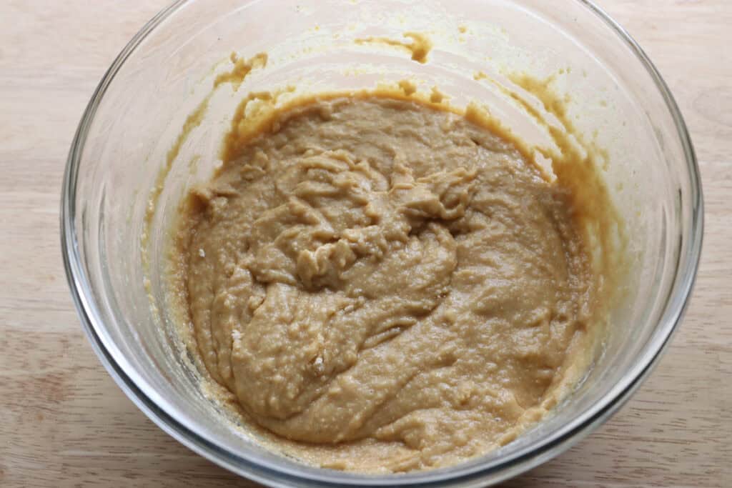 Freshly milled glazed strawberry bread batter in a glass bowl