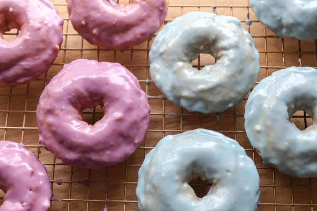 blue and purple Homemade Baked Spring Donuts with Fresh Milled Flour on a wire rack