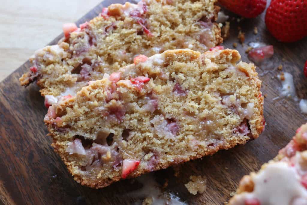 Two slices of freshly milled glazed strawberry bread
