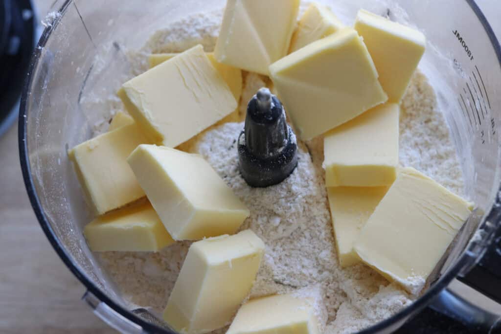 butter and flour in a food processor to make the dough for Fresh milled Easter egg sugar cookies