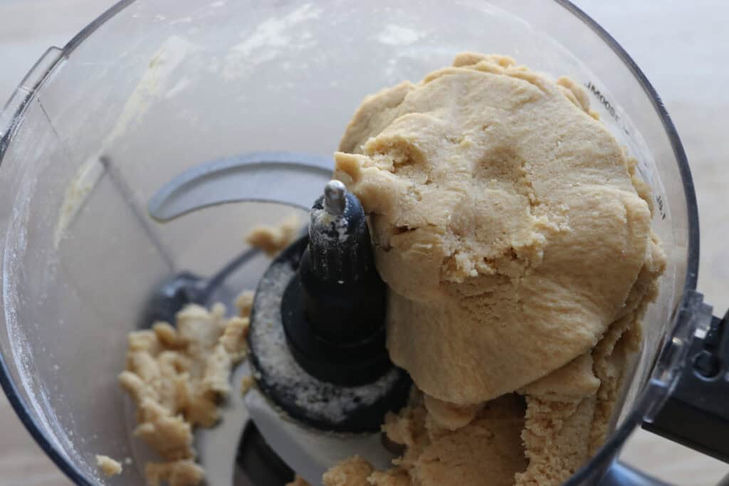 Fresh milled Easter egg sugar cookie dough in a food processor