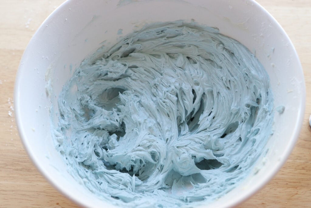 blue frosting in a bowl to go on top of the fresh milled Easter egg sugar cookies