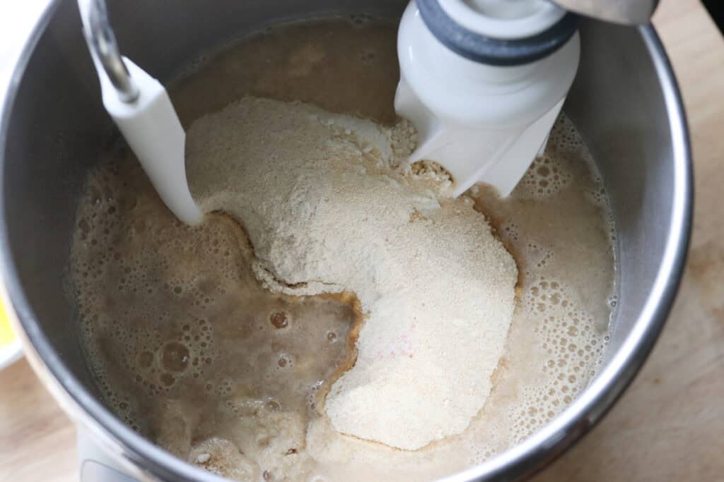 flour, water, and sugar in a mixing bowl to make Fresh Milled Soft Pretzel Bites 