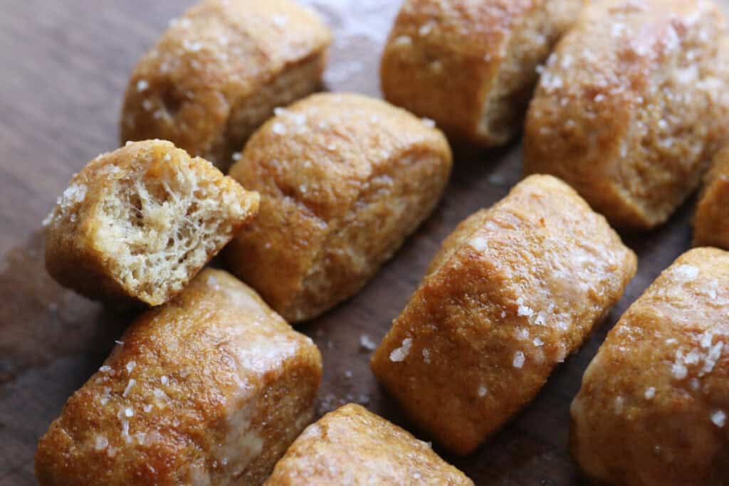 Fresh Milled Soft Pretzel Bites sprinkled with coarse salt and topped with garlic butter