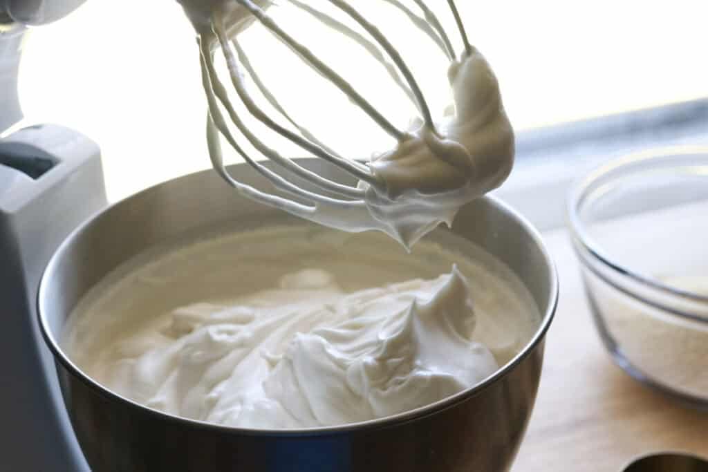 Egg whites that have been whipped to stiff peaks to make the freshly milled angel food cake