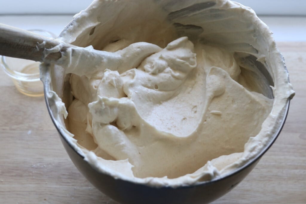 Egg whites that have sugar and flour folded into them to make the freshly milled angel food cake