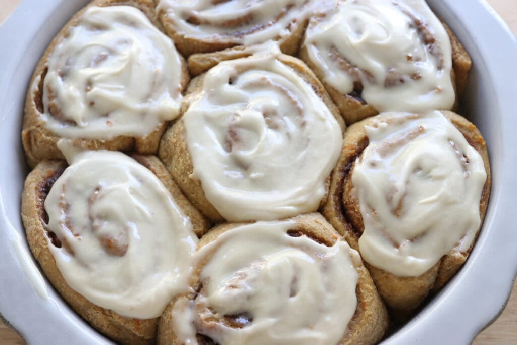 Fresh milled carrot cake cinnamon rolls in a baking dish