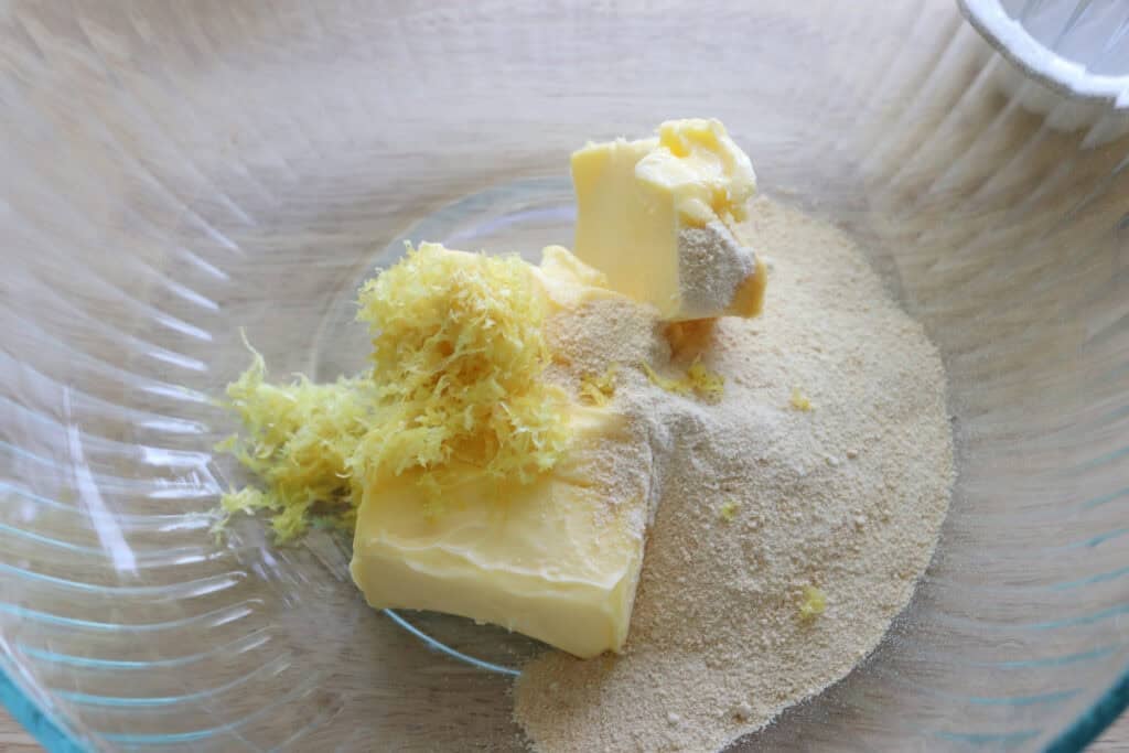 butter and lemon zest and sugar in a bowl to make Fresh milled glazed lemon cookies
