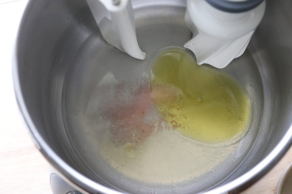 oil, honey, salt, and lemon juice in the bowl of a stand mixer to make freshly milled einkorn sandwich bread