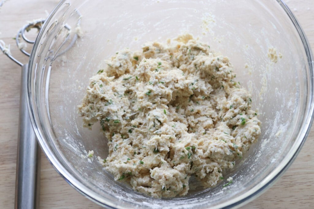Freshly Milled Parmesan Chive Drop Biscuit dough in a glass bowl 