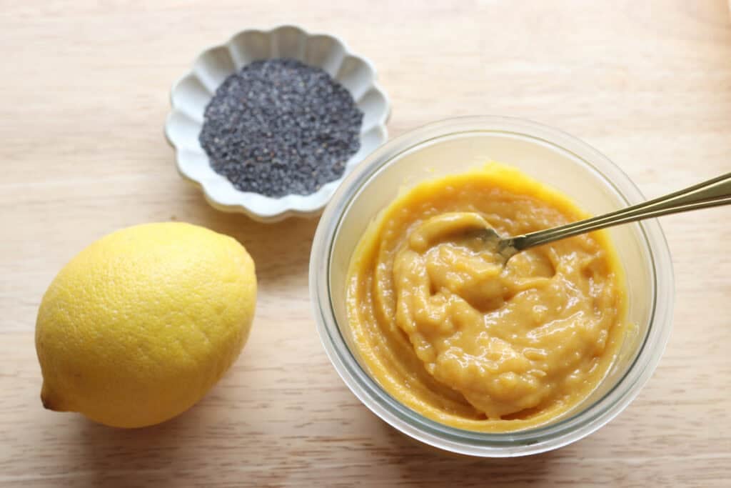 lemon curd in a glass bowl for the freshly milled lemon poppyseed rolls