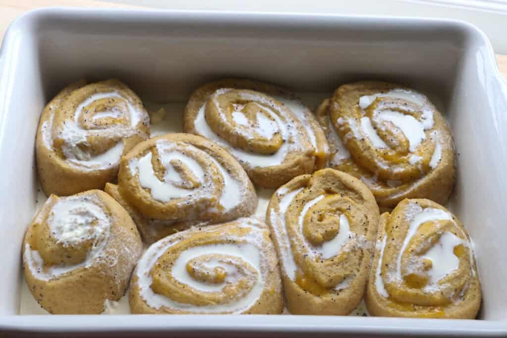 freshly milled lemon poppy seed rolls covered in heavy cream
