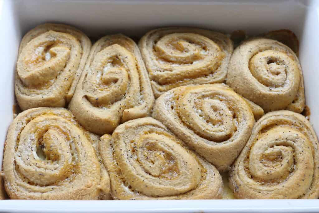 freshly milled lemon poppy seed rolls that have been baked in a casserole dish