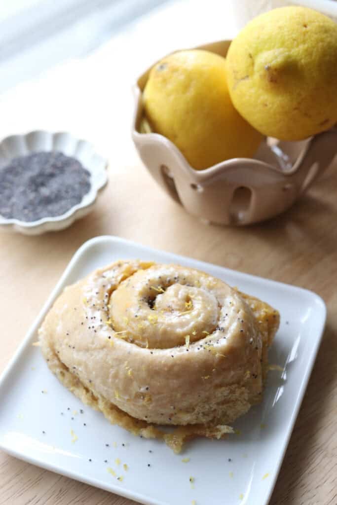 a freshly milled lemon poppyseed roll on a white plate