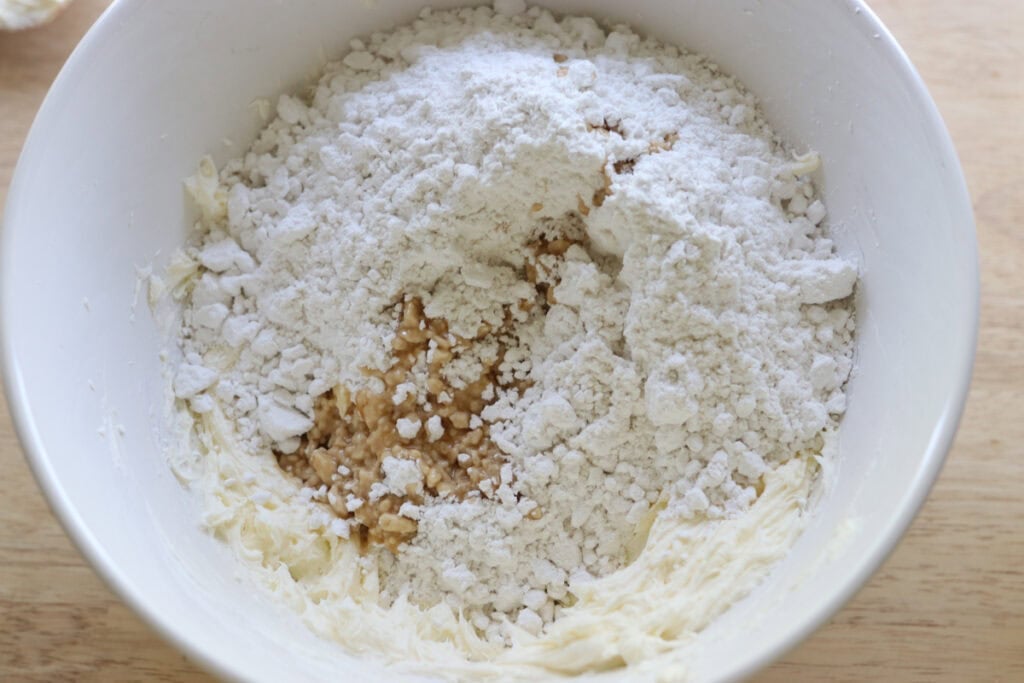 powdered sugar and cream cheese in a bowl for the frosting for freshly milled frosted banana bars