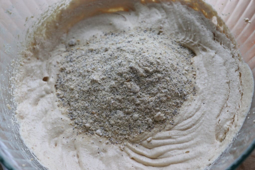 flour and orange zest added to the Freshly milled orange almond poppy seed cake batter