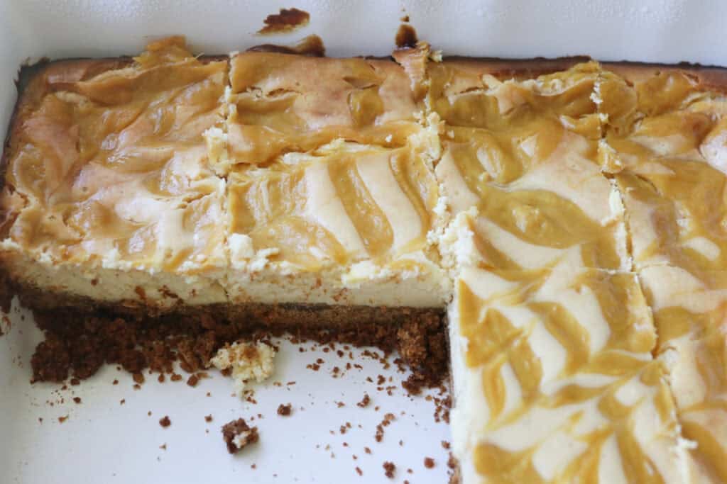 Freshly milled mango cheesecake bars that have been sliced
