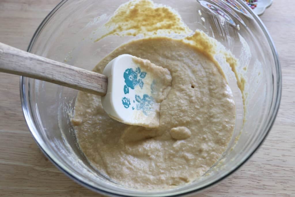 Freshly milled cake pop batter in a glass bowl