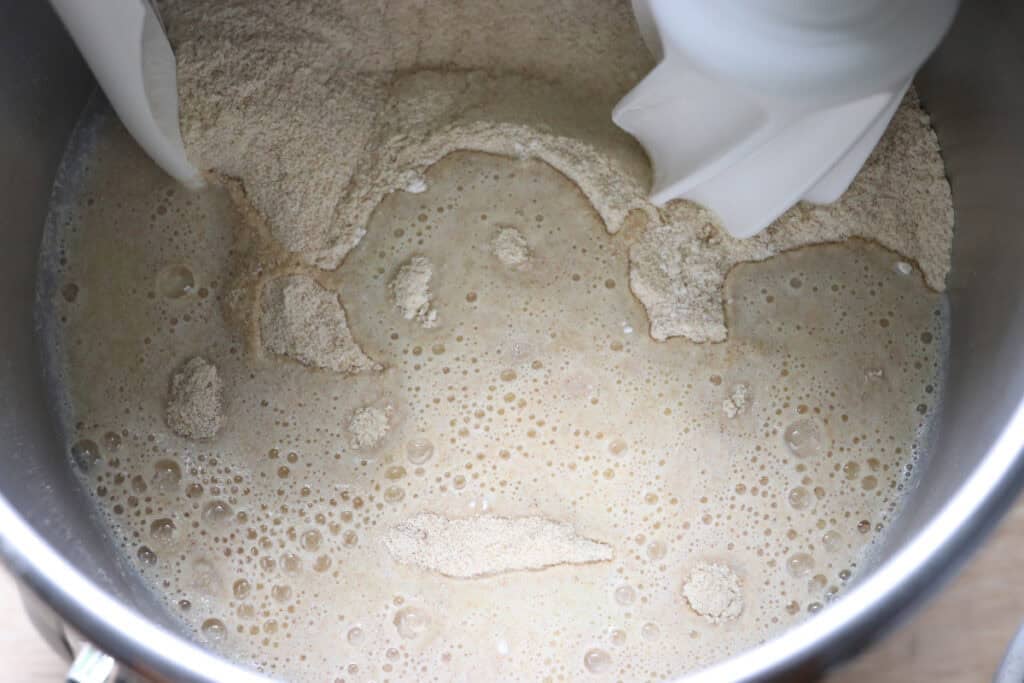 wet ingredients added to the flour to make freshly milled english muffin toasting bread