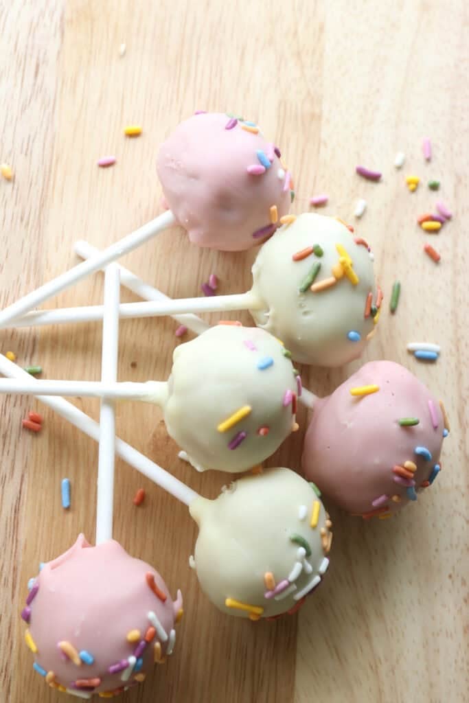 Freshly milled cake pops on a wooden board