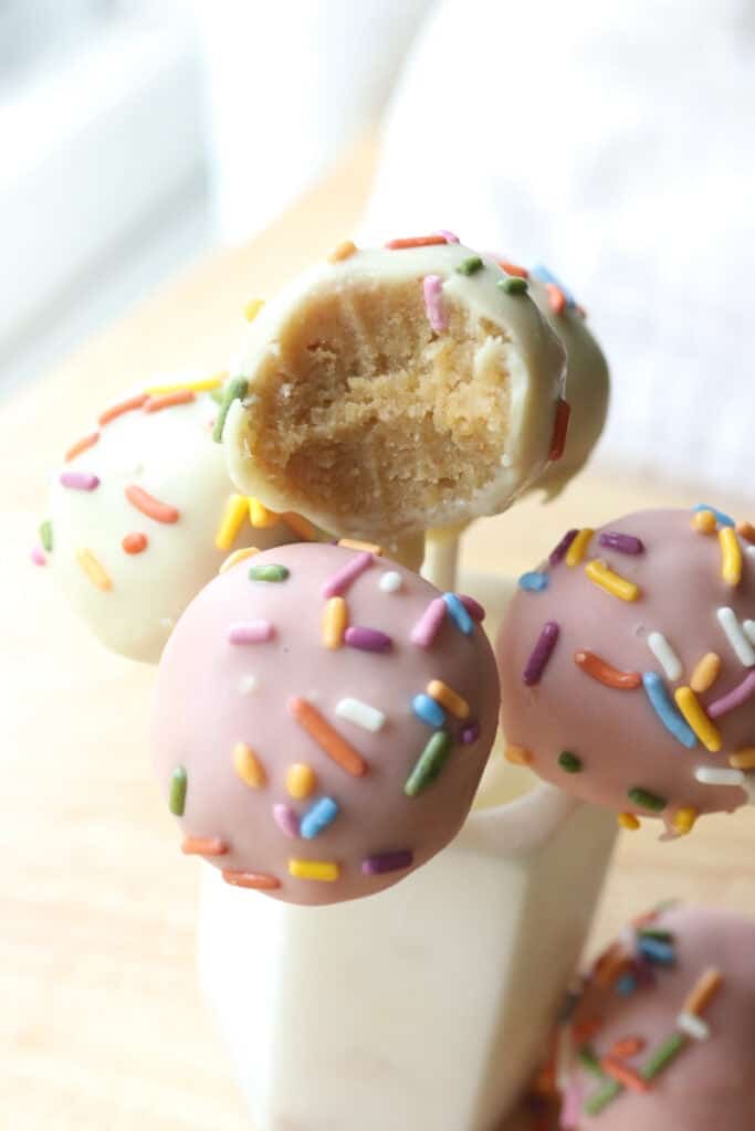 Freshly milled cake pops with a bite taken out of one