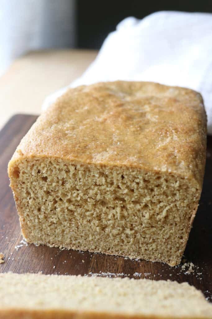 half a loaf of freshly milled english muffin toasting bread on a cutting board